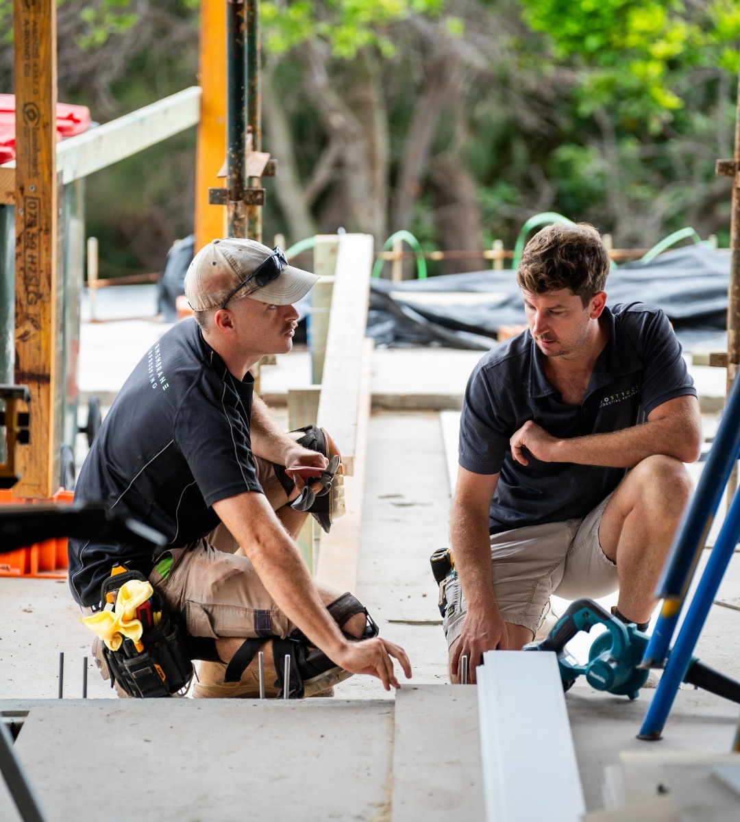 Sam Evans on site with a team member during construction